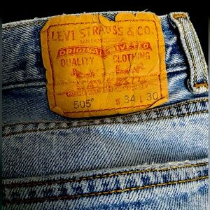 Vintage Levi’s 505 Light Wash Distressed Denim (Unisex)